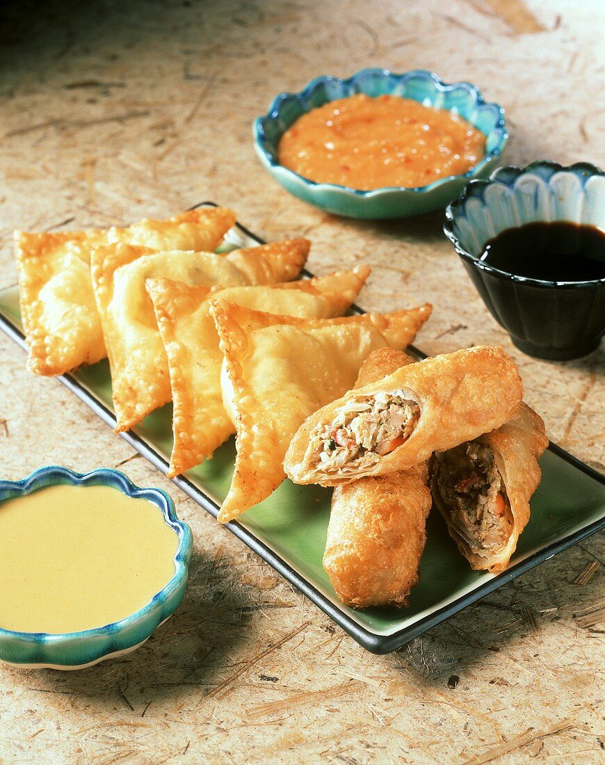 Egg Rolls on a Platter, Crab Rangoon and Three Sauces