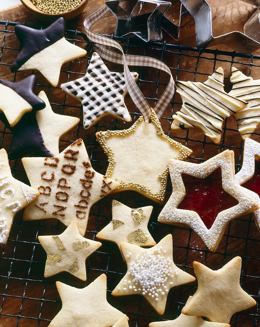 Various sized shortbread stars on a wire rack