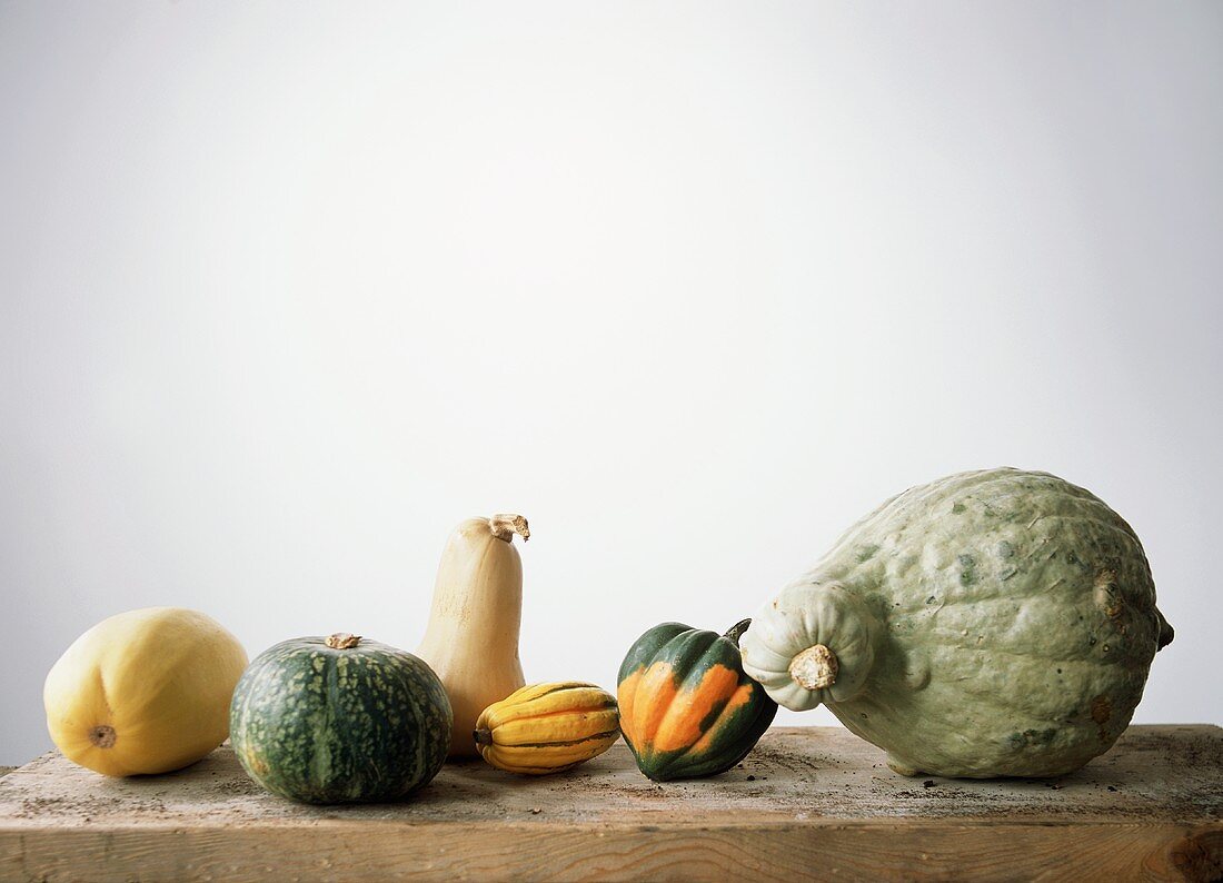 Assorted squashes on wooden table