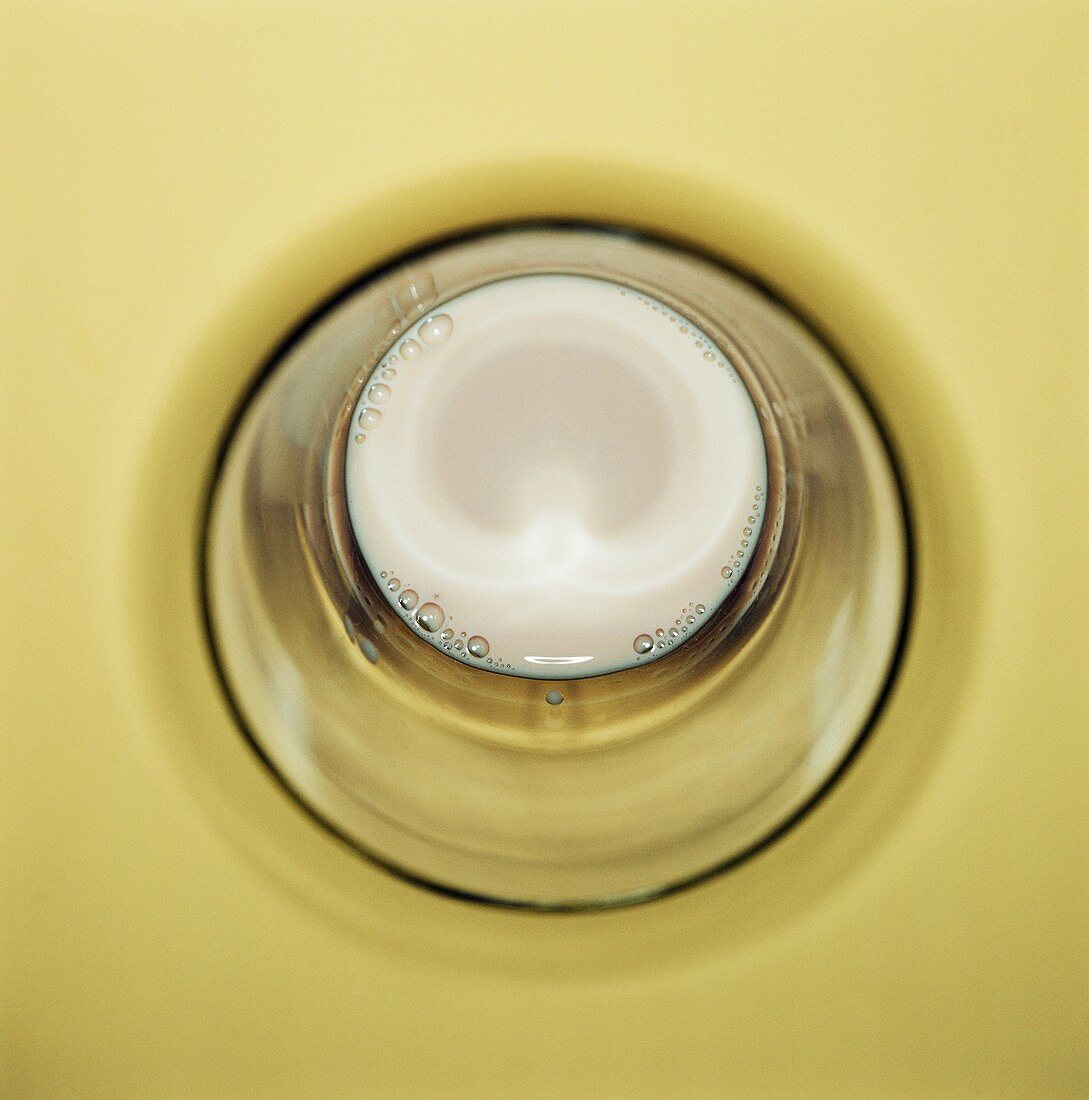 Overhead view into a glass of milk