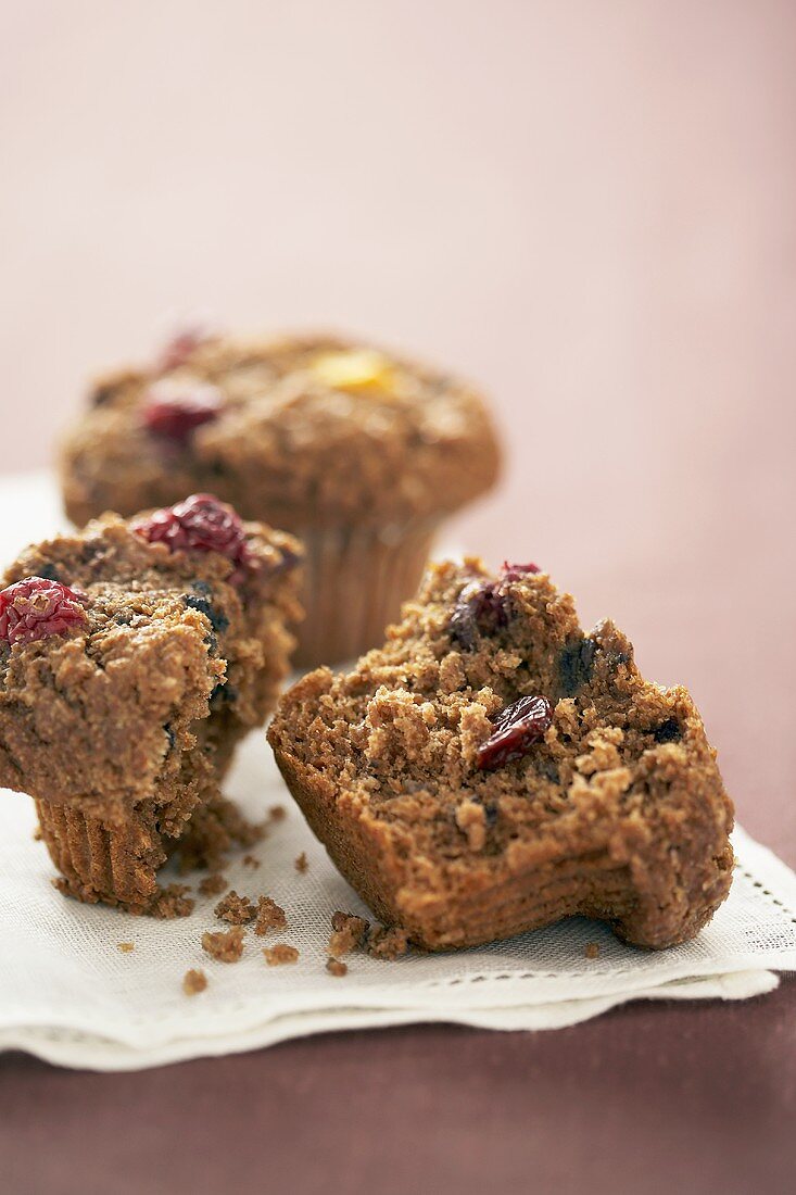 Two cranberry bran muffins, one halved