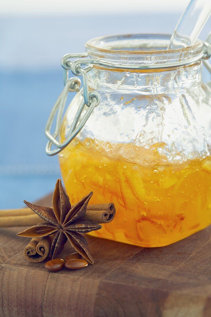 Jar of orange marmalade, star anise and cinnamon sticks