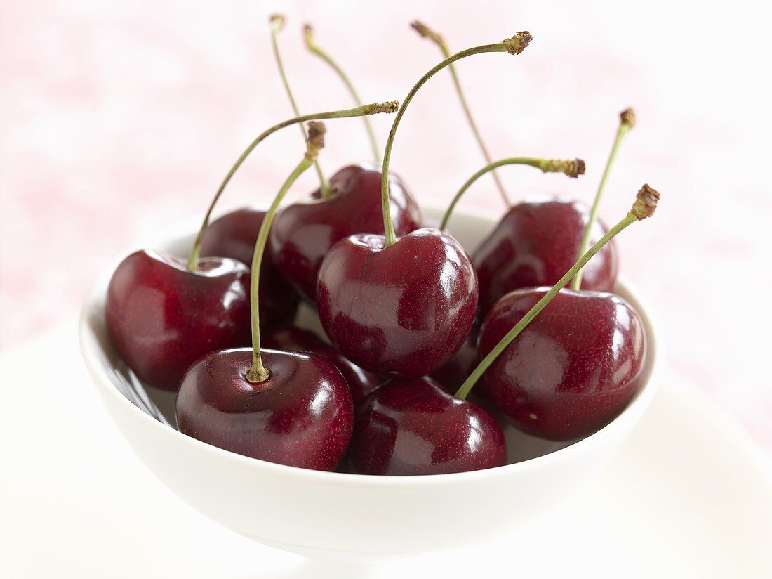 Fresh cherries in white bowl