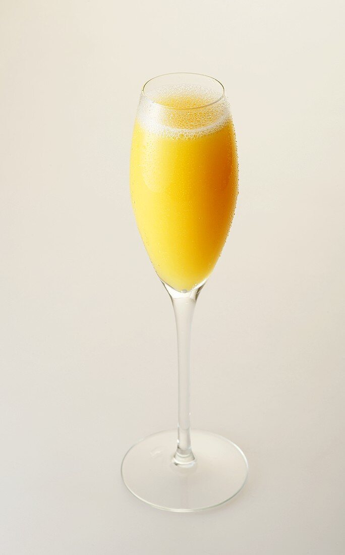 Mimosa in sparkling wine glass