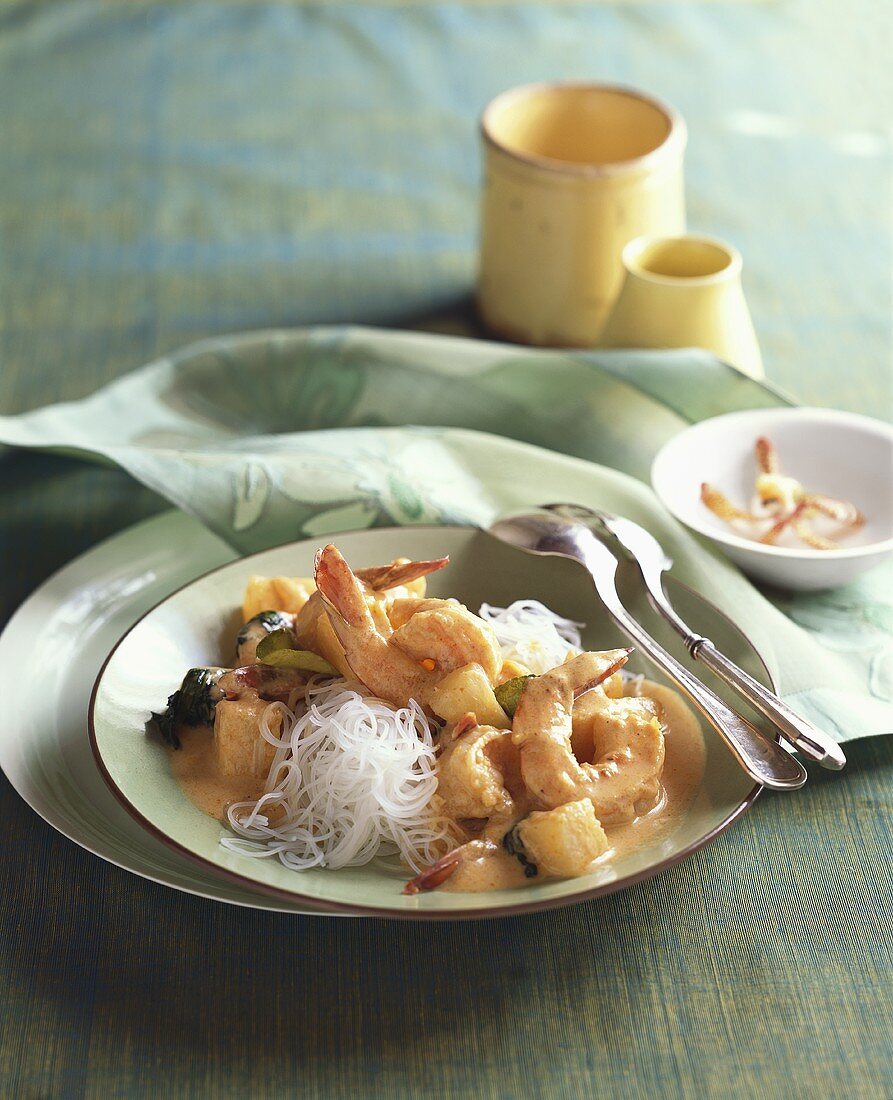 Shrimps with pineapple in red curry sauce, glass noodles