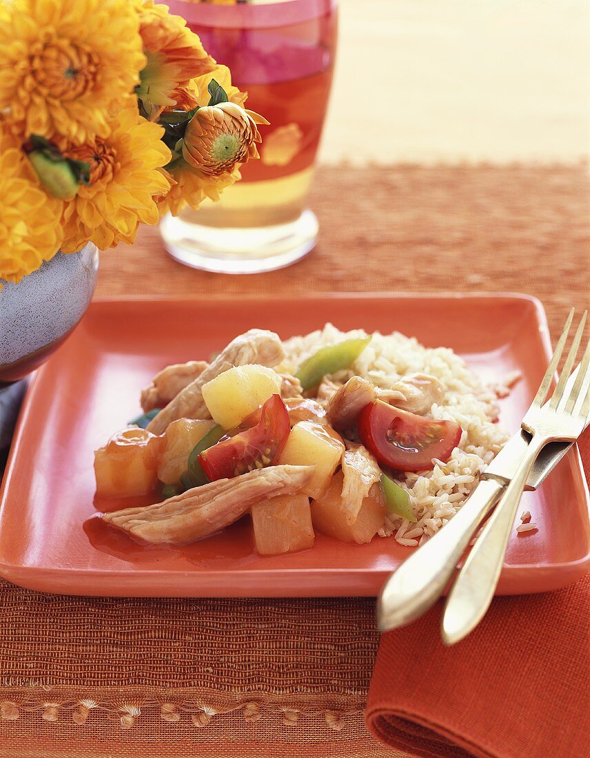 Sweet and sour chicken with pineapple, vegetables and rice