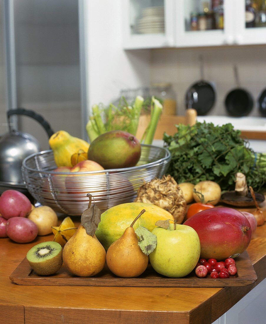 Assorted fruit and vegetables in a kitchen