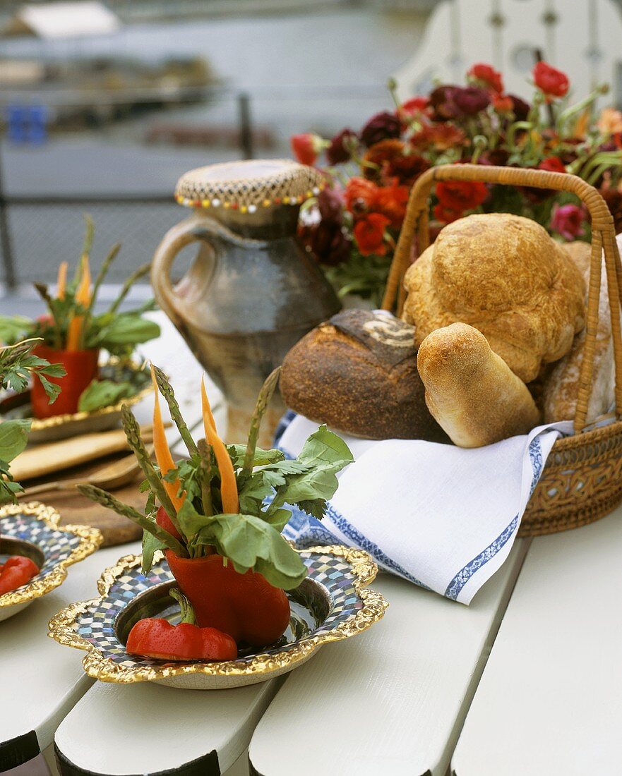 Vegetable decorations and bread basket on table