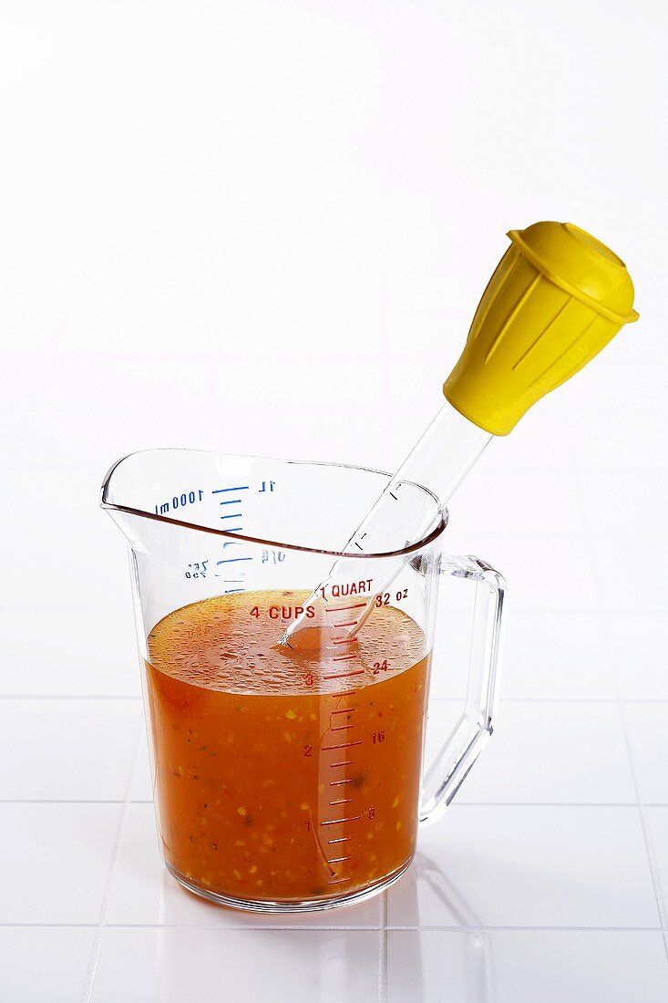 Baster in a Measuring Glass of Broth
