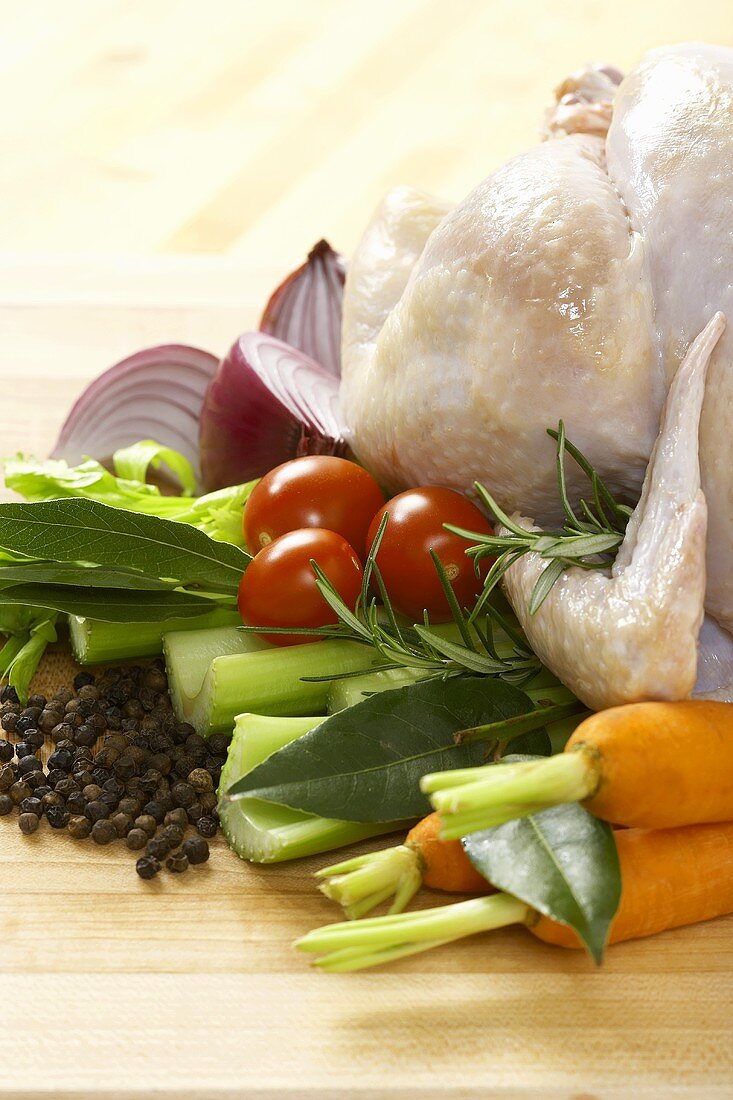 Ingredients For Roast Chicken and Vegetables, Whole Chicken with Carrots Celery Onion and Peppercorns