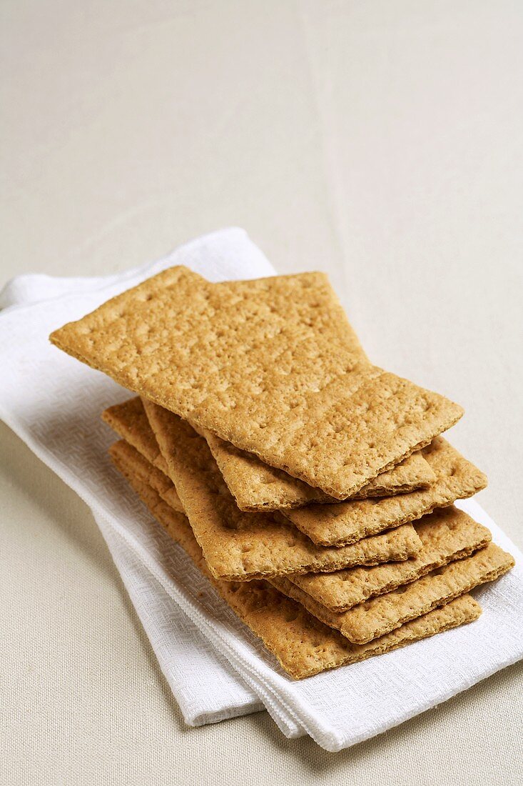 Graham Crackers Stacked on a White Cloth Napkin