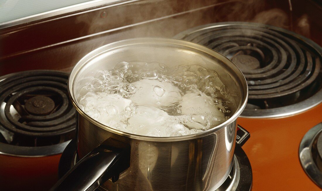 White Eggs Boiling in a Saucepan