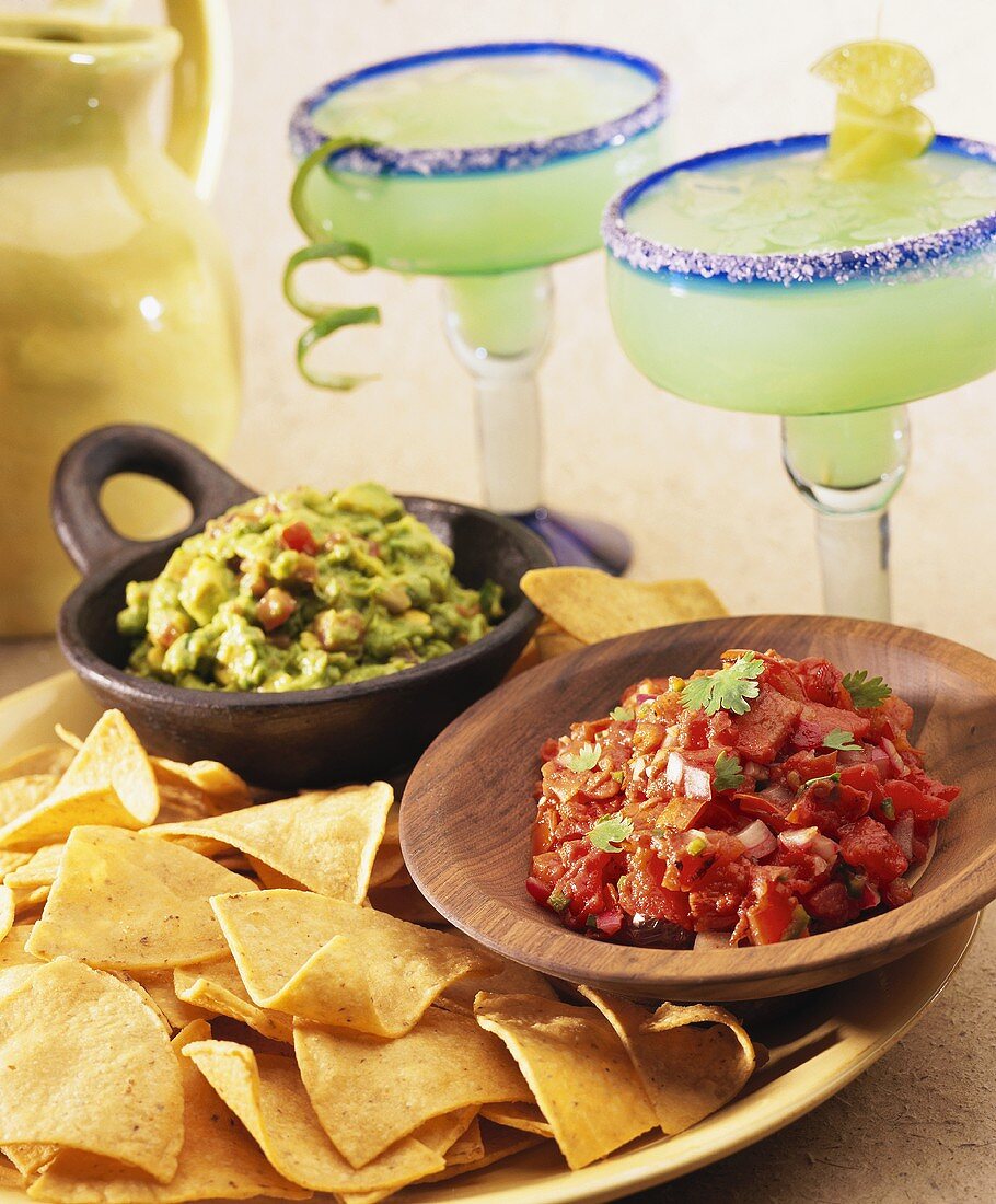 Plate of Tortilla Chips, Guacamole and Salsa with Two Margaritas