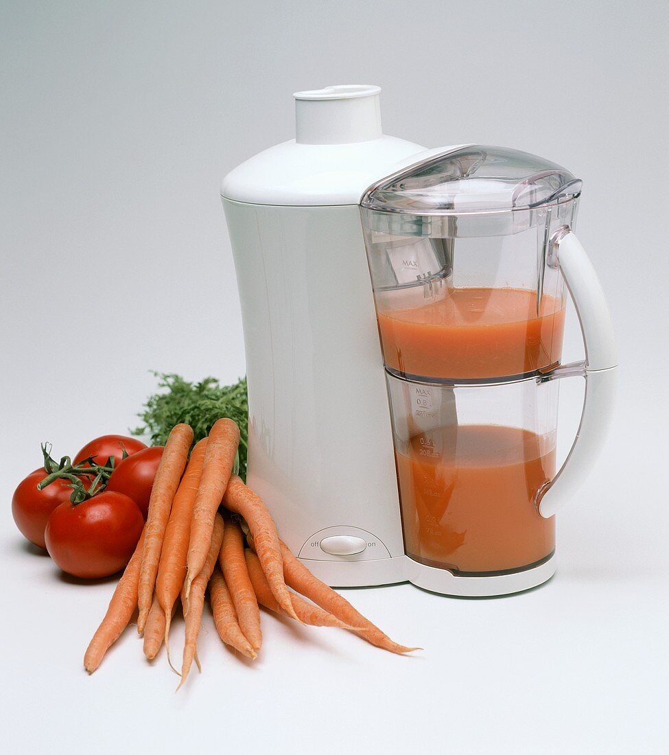 Krups Juice Machine with Carrots and Tomatoes