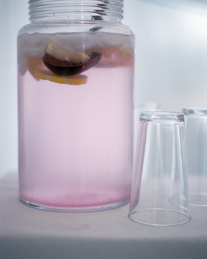 A Jug of Pink Lemonade with Glasses