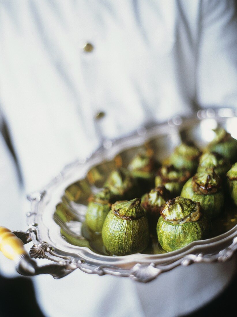 Chef Holding a Tray Stuffed Tomatillos