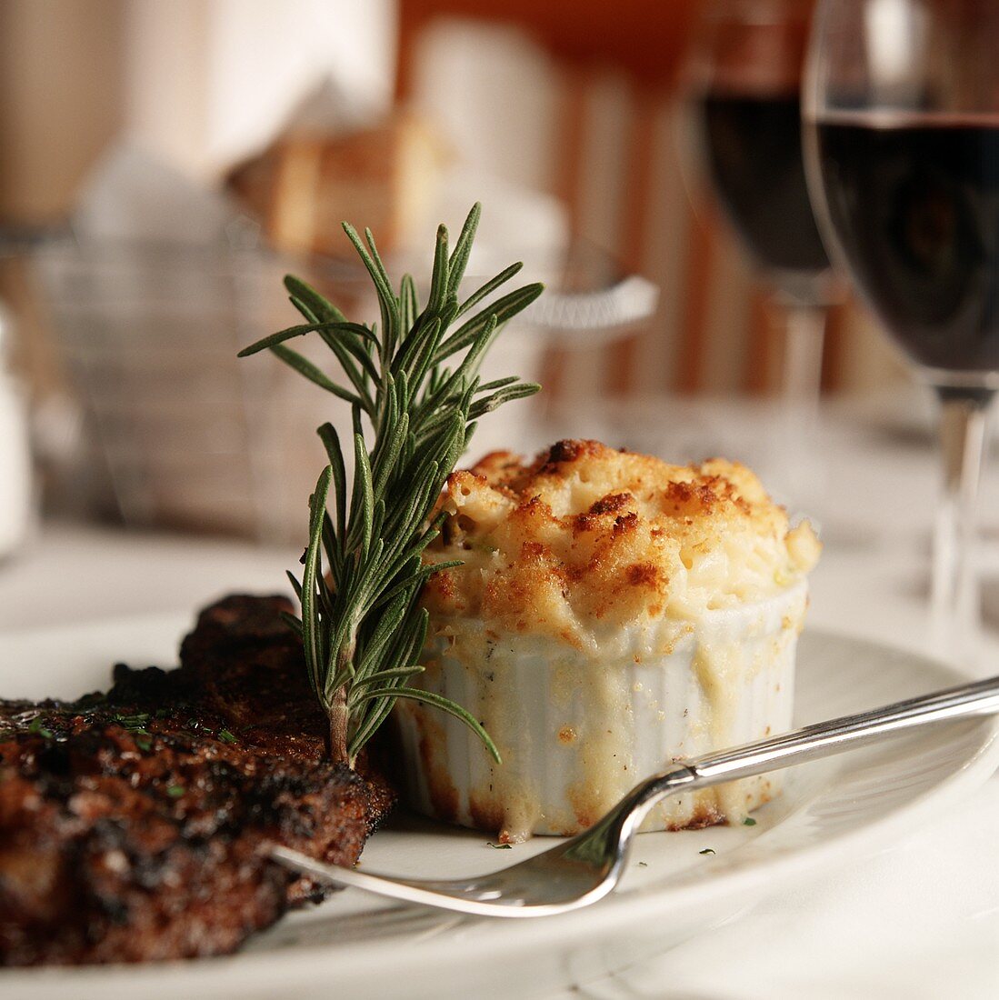 Individual Macaroni and Cheese with a Steak