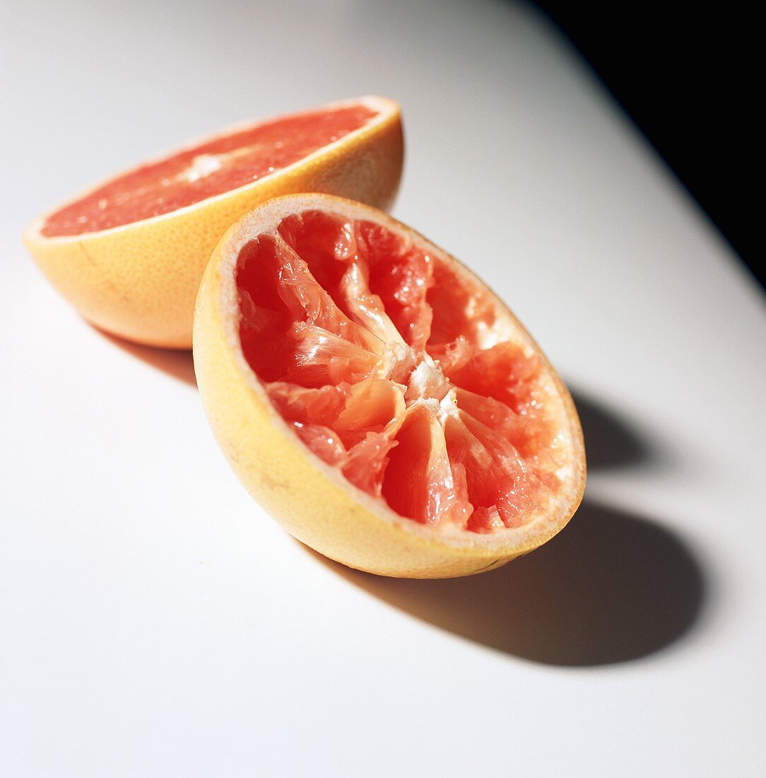 Two Squeezed Pink Graphfruit Halves
