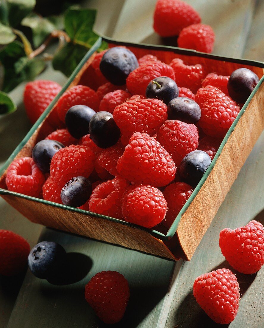 Raspberries and Blueberries on a Wooden Tray