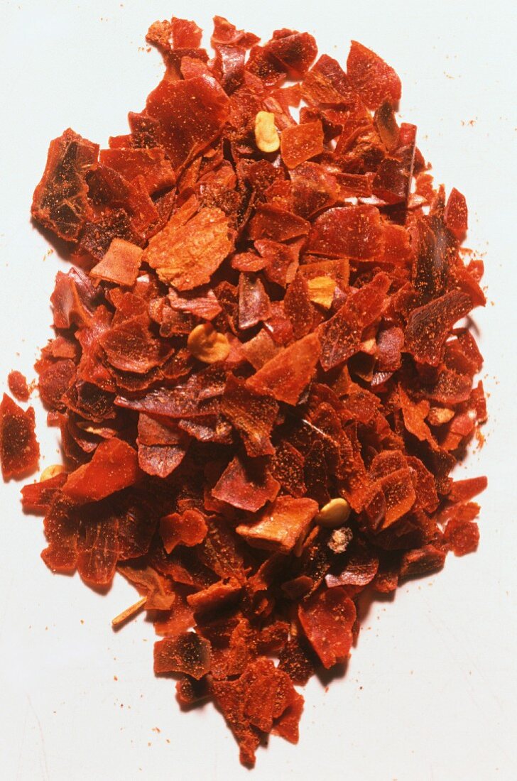 Crushed Dried Chili Peppers on a White Background
