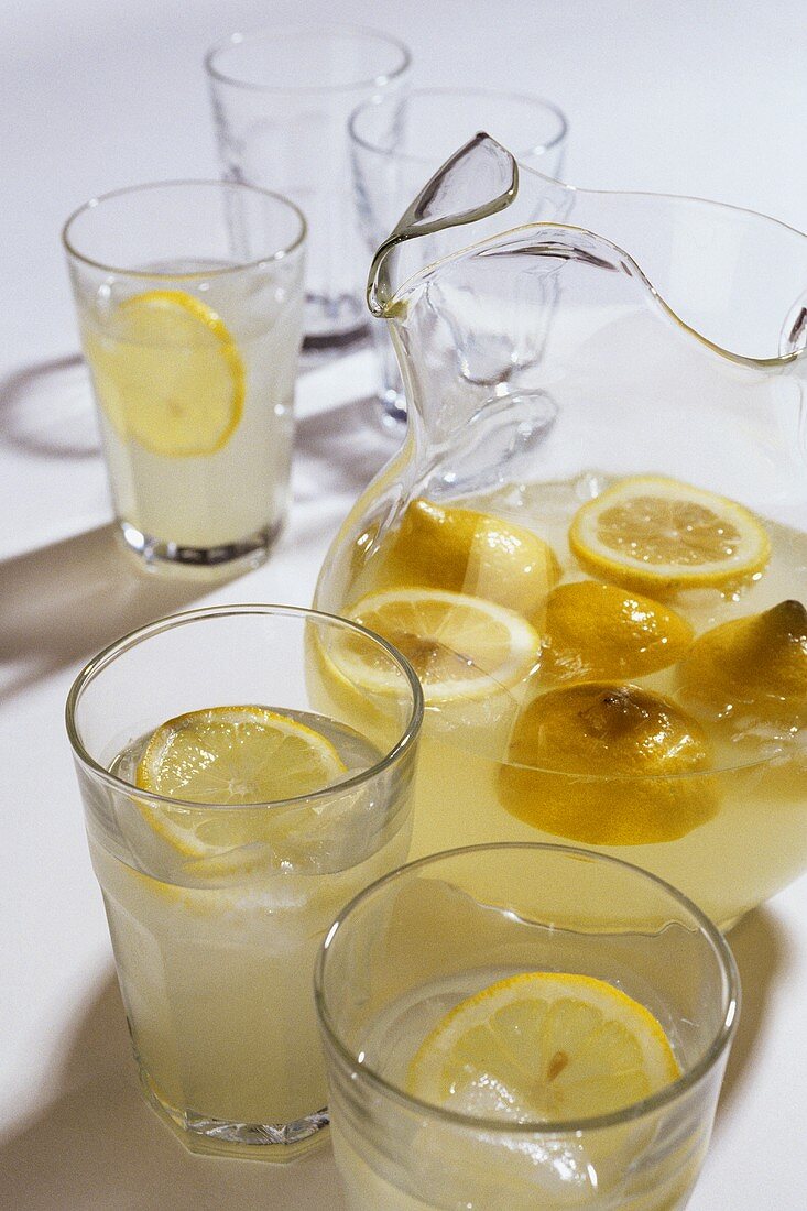 Lemonade in a Pitcher and Several Glasses