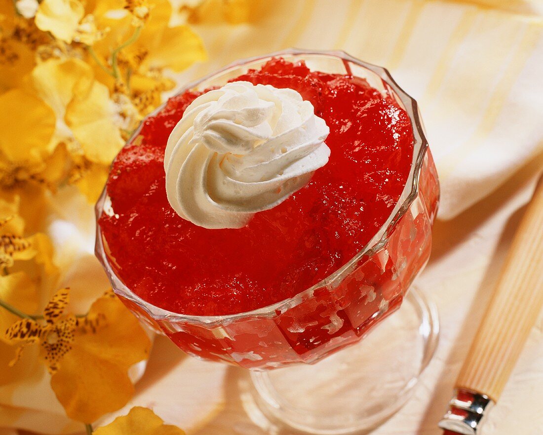 Strawberry Jello with Whip Cream in a Glass Dish