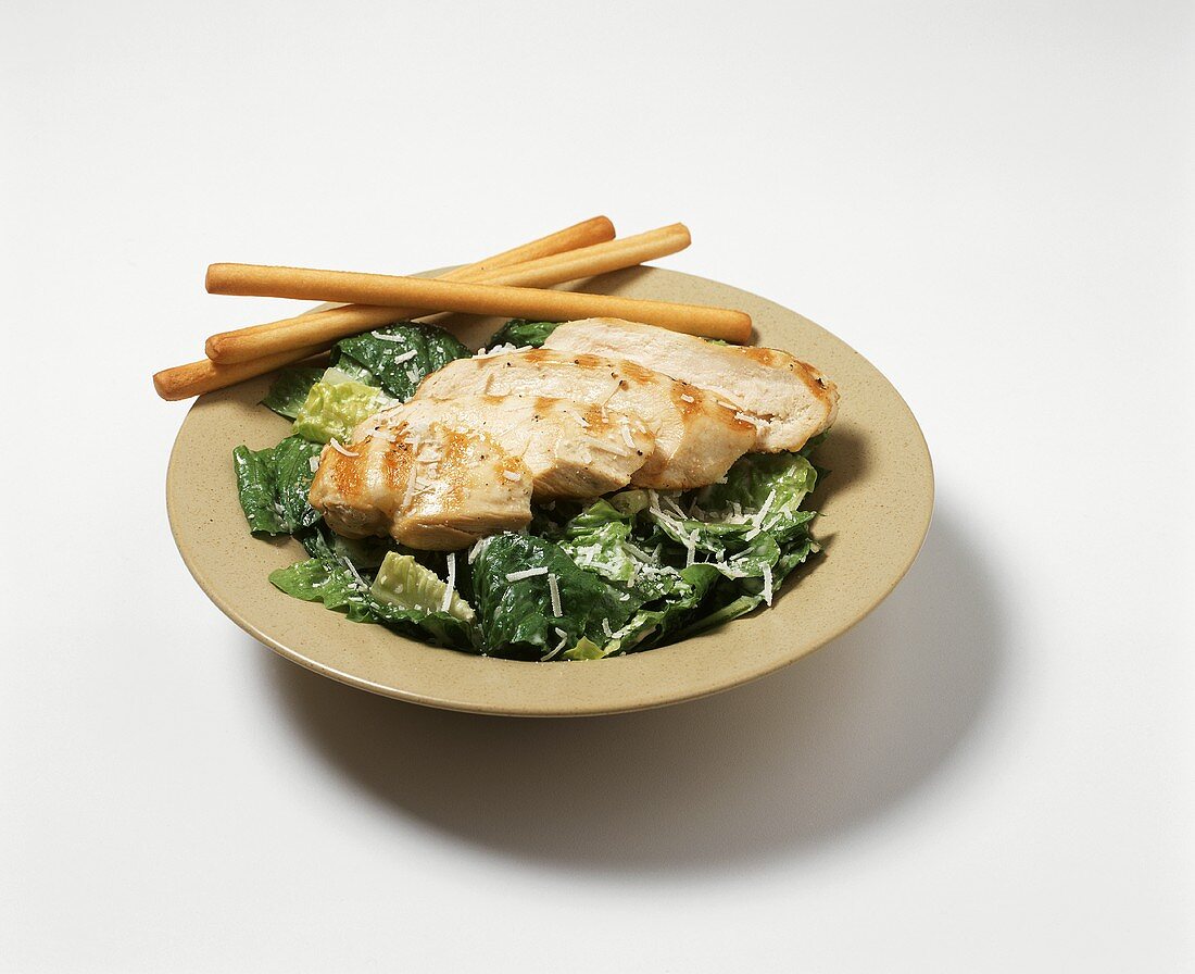 Grilled Chicken Caesar Salad with Bread Sticks