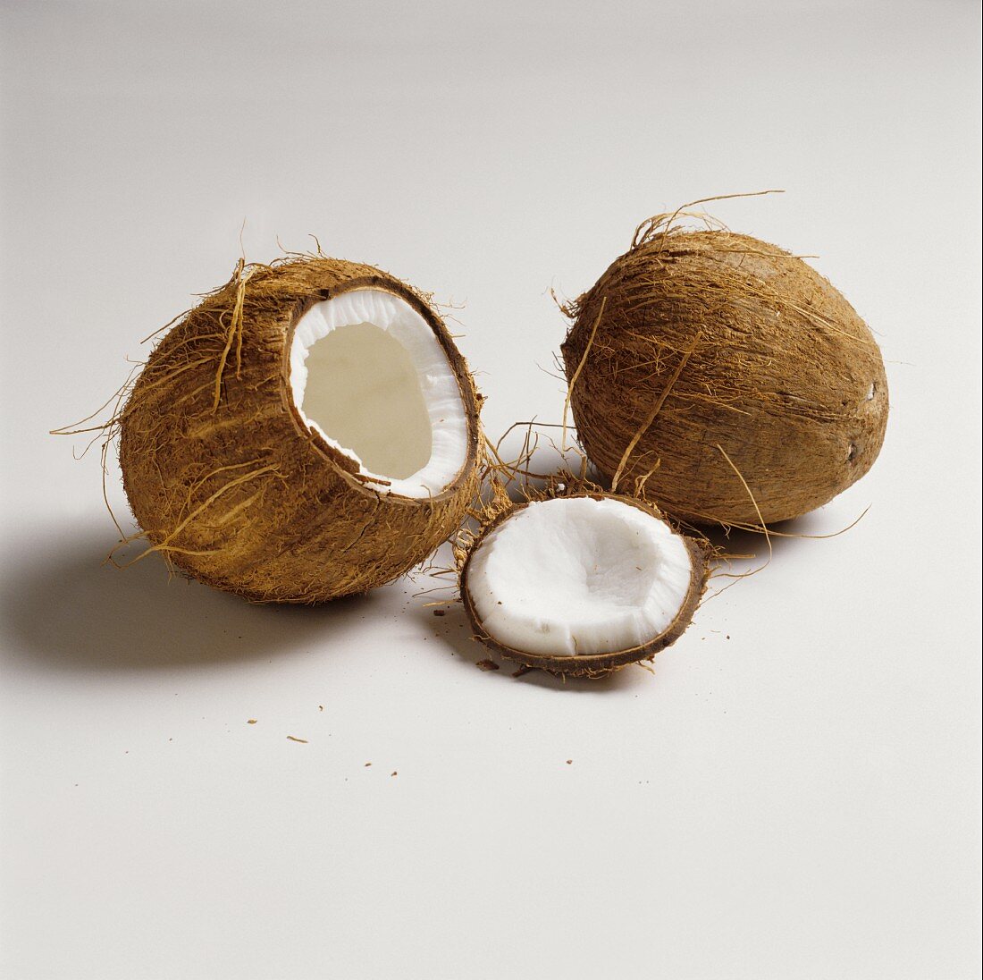 Two Coconuts; One Whole and One with Top Cut Off