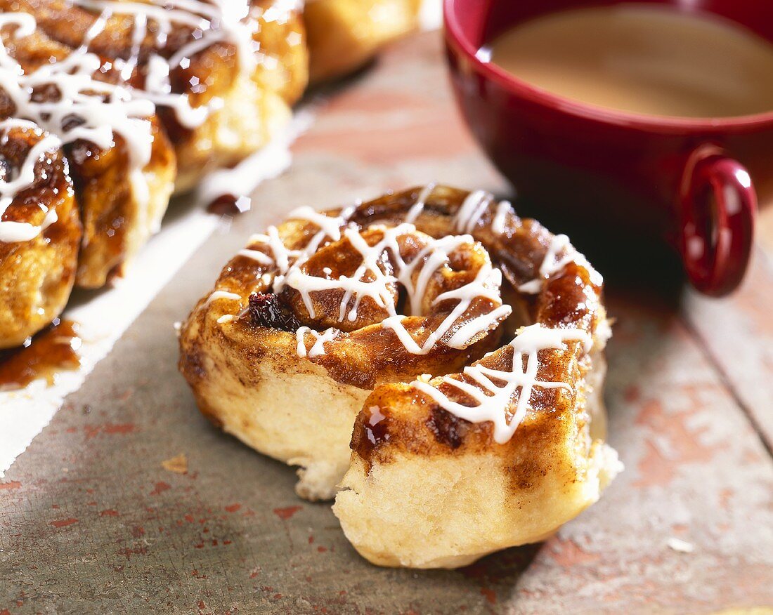 Cinnamon Sticky Bun with a Cup of Coffee