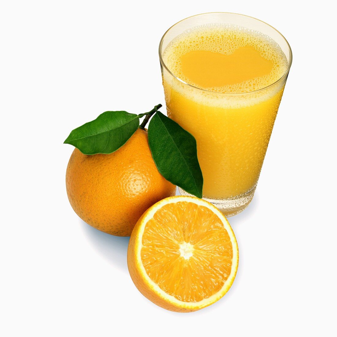 Glass of Orange Juice with Whole and Half Orange