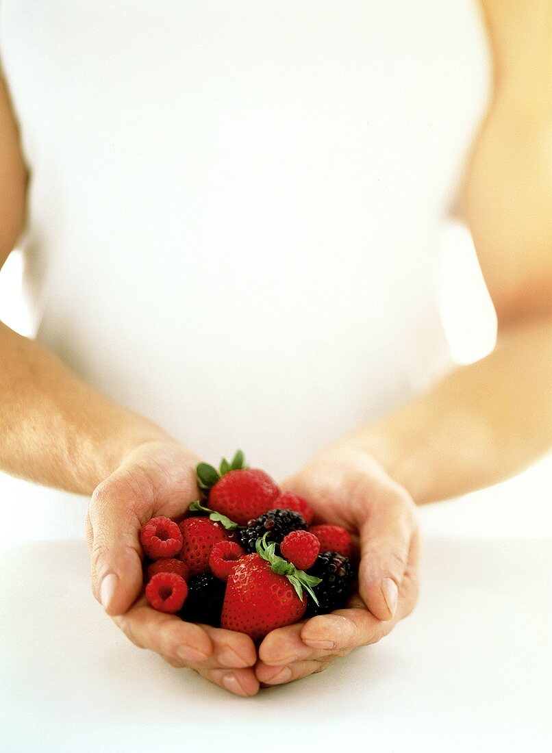 Hands Holding Berries