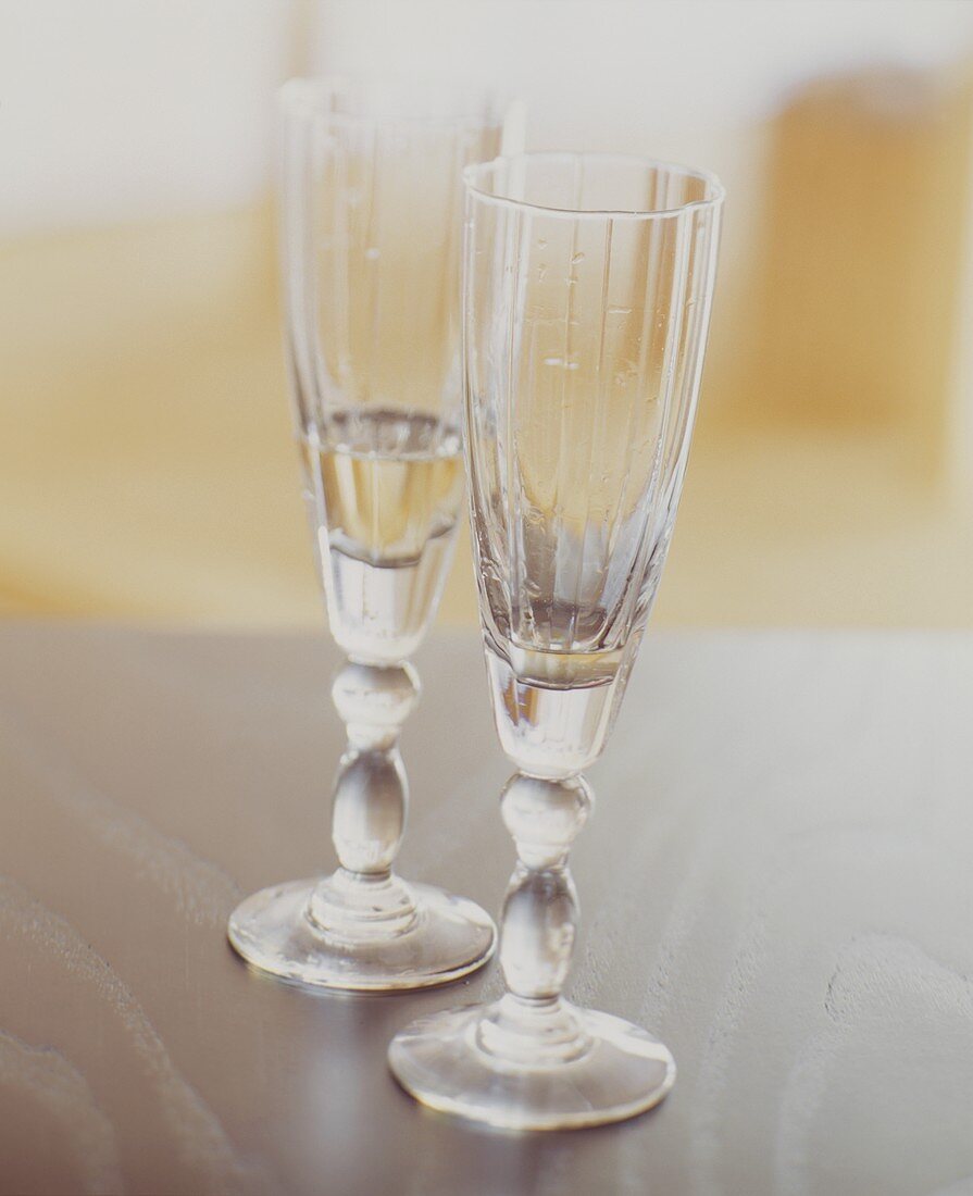 Two Champagne Flutes, Partially Filled