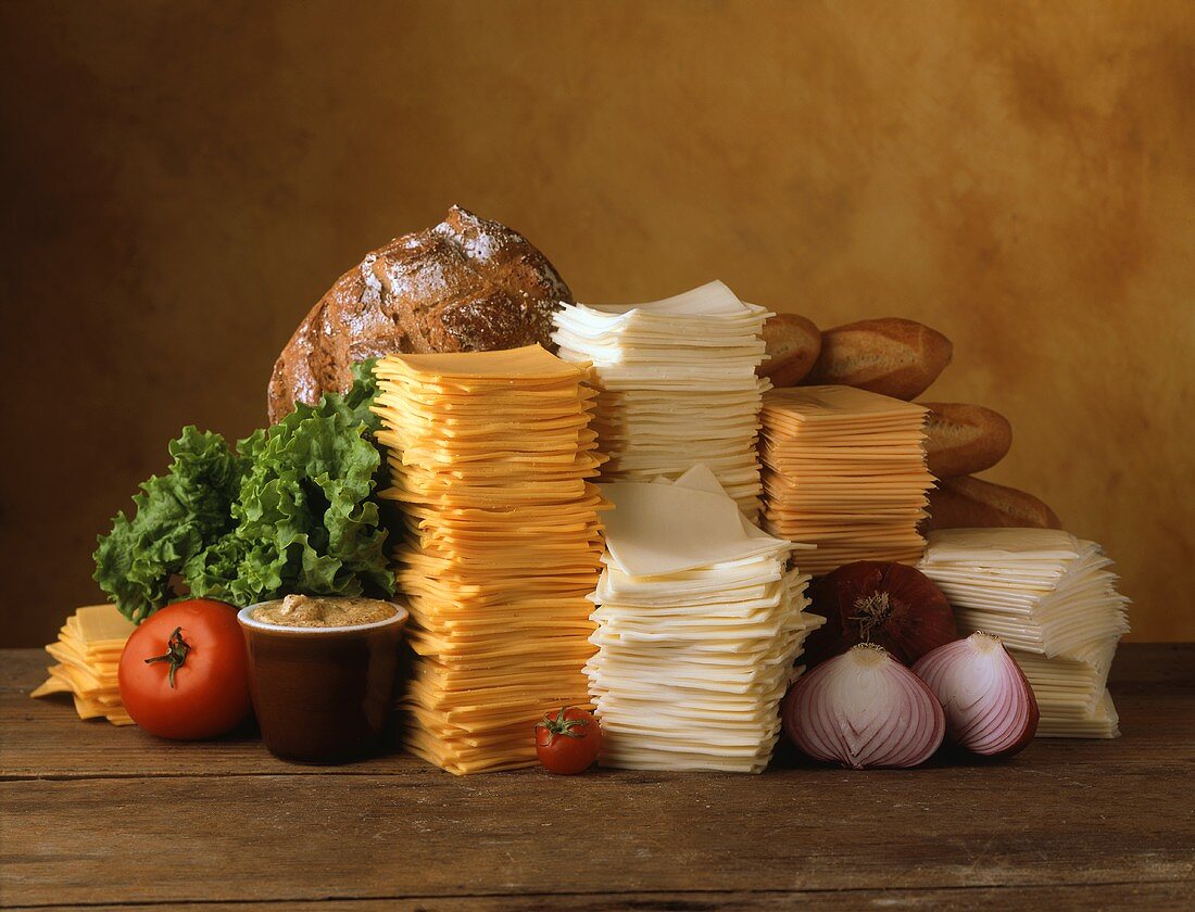 Stacks of Sliced Cheeses