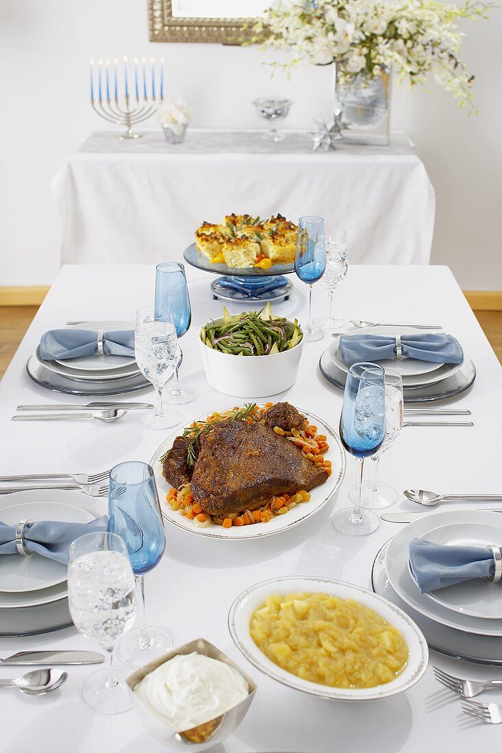 Full Hanukkah Meal on Set Table