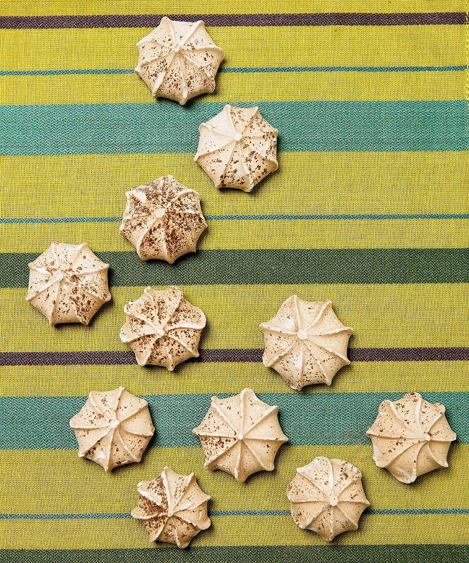 Many Chocolate Meringue Cookies on Striped Cloth