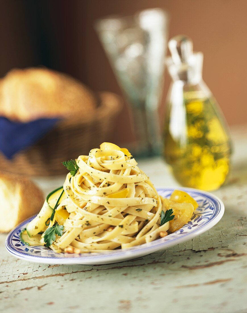 Serving of Fettucini Tossed with Parsley, Yellow Tomato and Zucchini