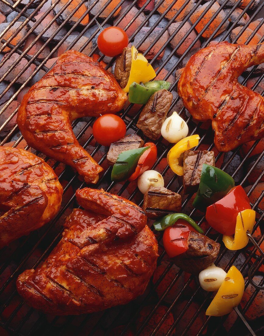 Barbecue Chicken and Kabobs on the Grill Over Hot Coals