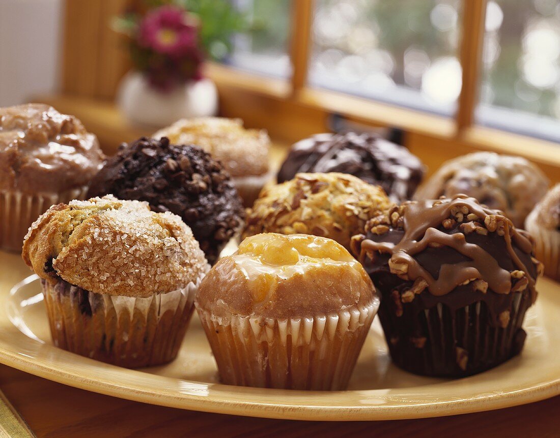 Assorted Muffins on a Plate by the Window