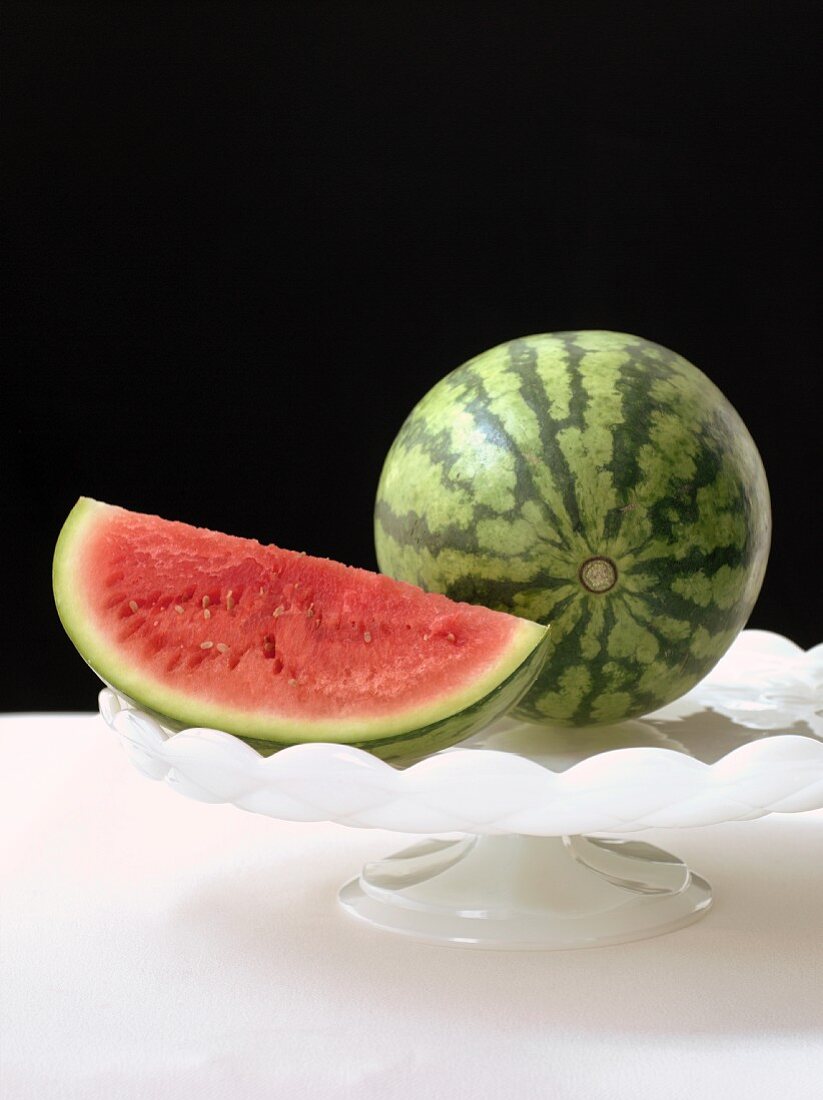 Watermelon Wedge with a Whole Watermelon on a Pedestal Dish