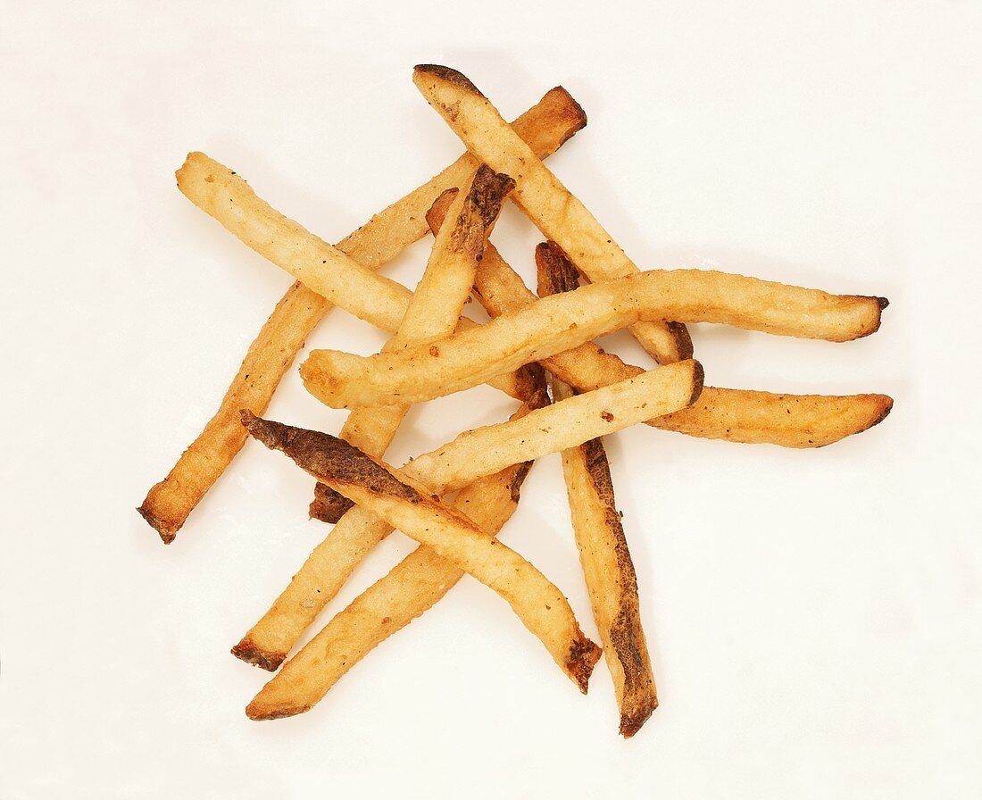 A Pile of Shoestring French Fries on a White Background