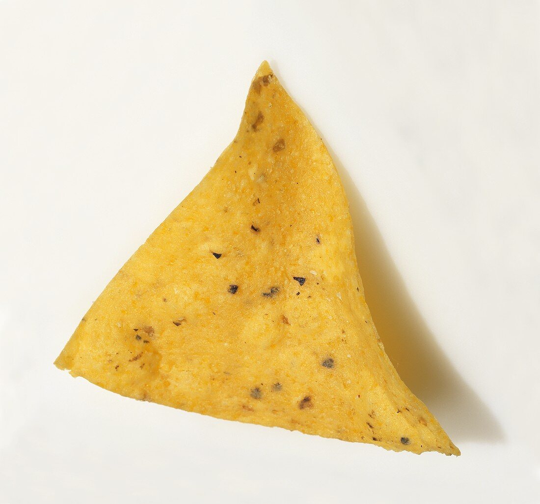 A Single Yellow Corn Tortilla Chip on a White Background