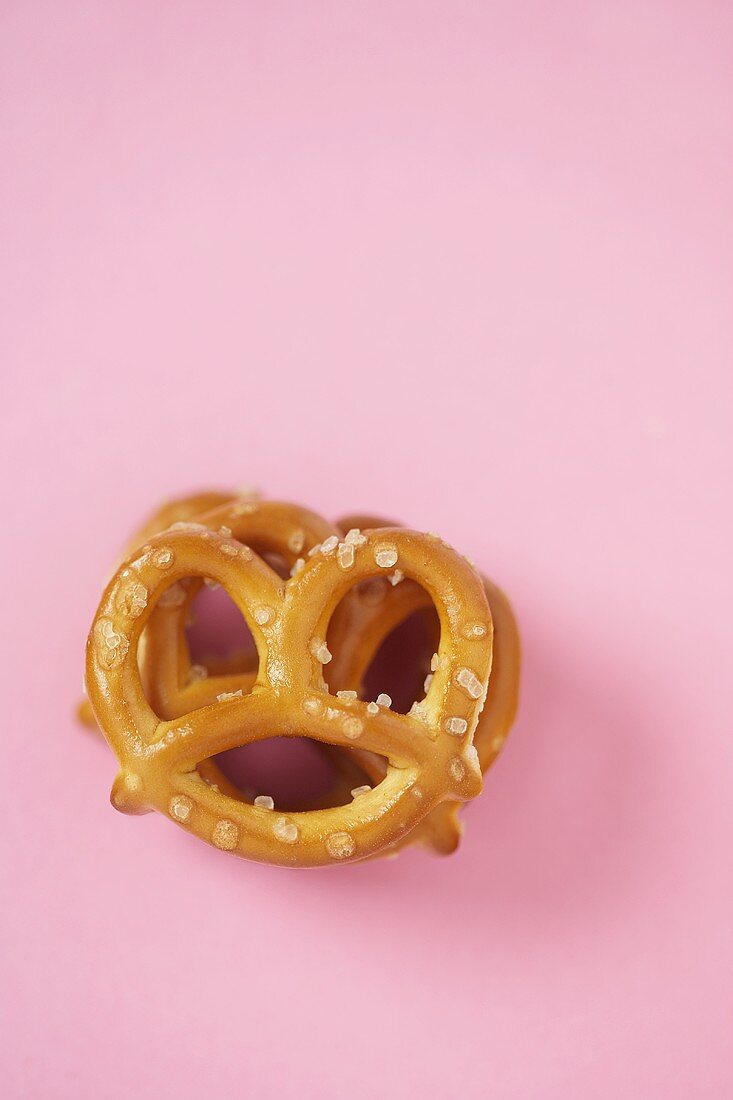 Small Stack of Pretzels on a Pink Background