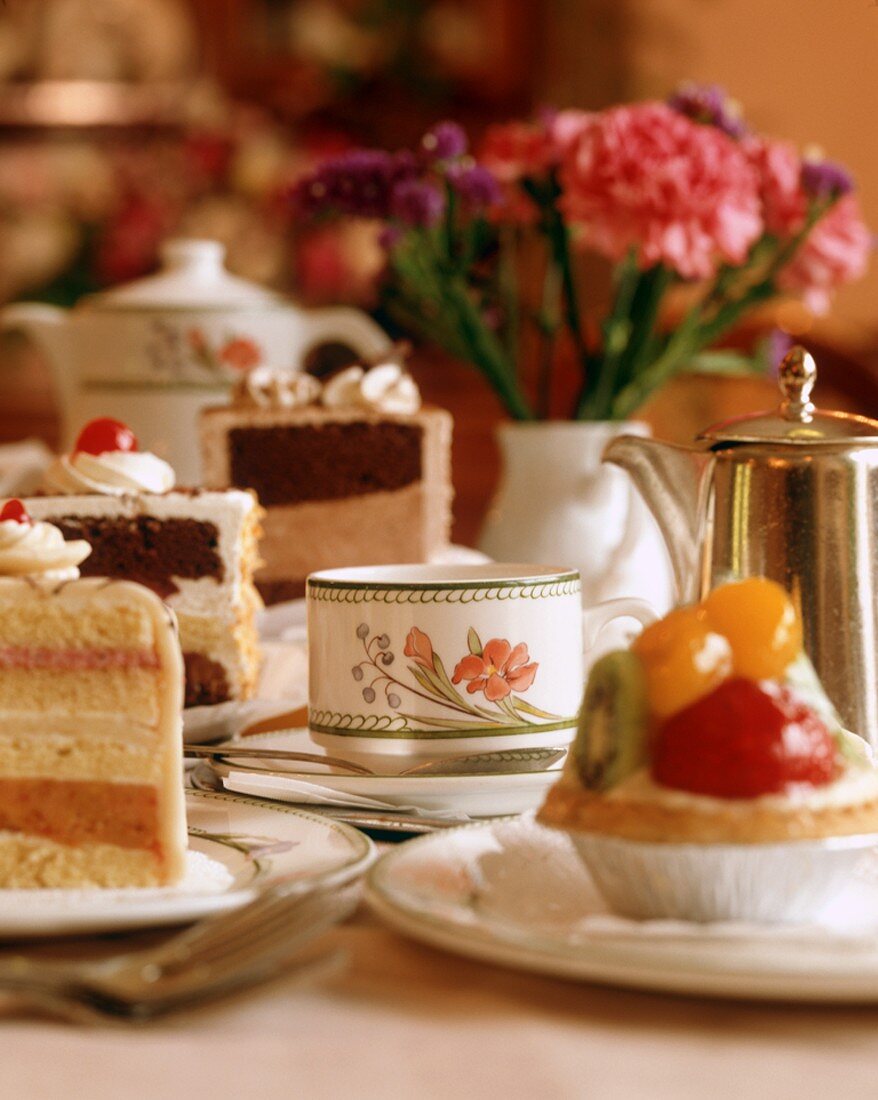 Tea Service with Slices of Layered Cake and Pastries