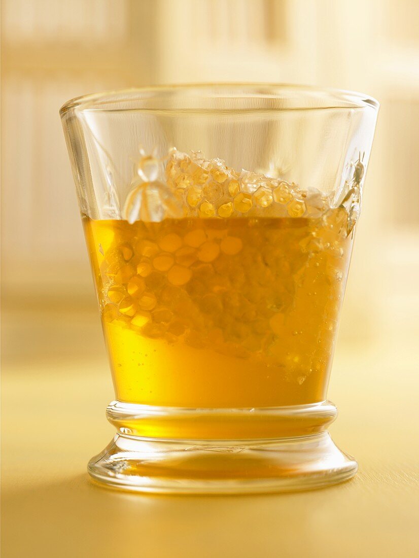 Honey with Honeycomb in a Glass
