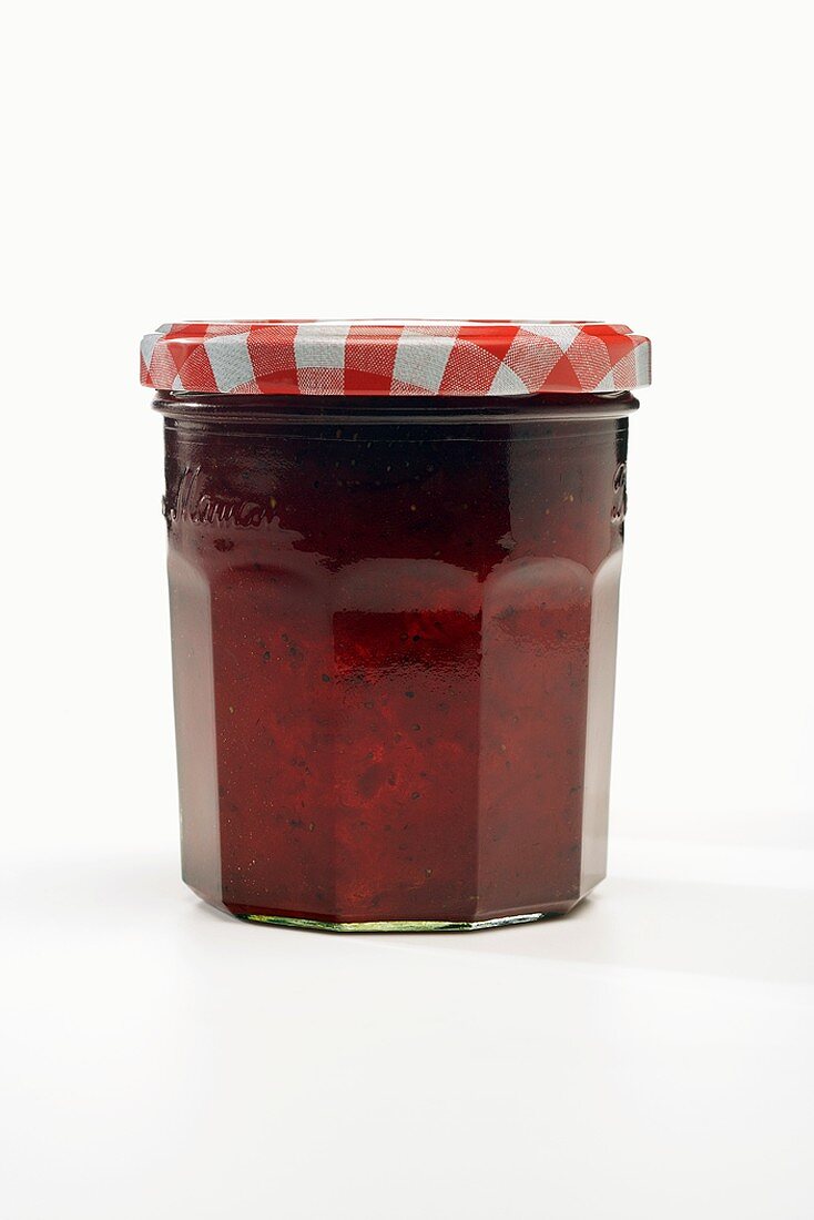 A Single Jar of Strawberry Jam on a White Background