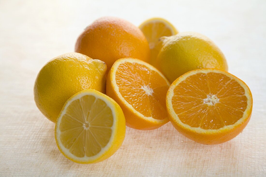 Fresh Whole and Halved Lemons and Oranges