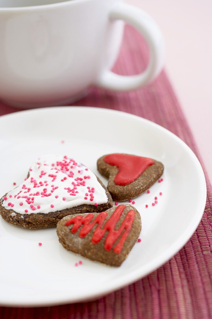 Three Frosted, Chocolate Heart Shaped Cookies