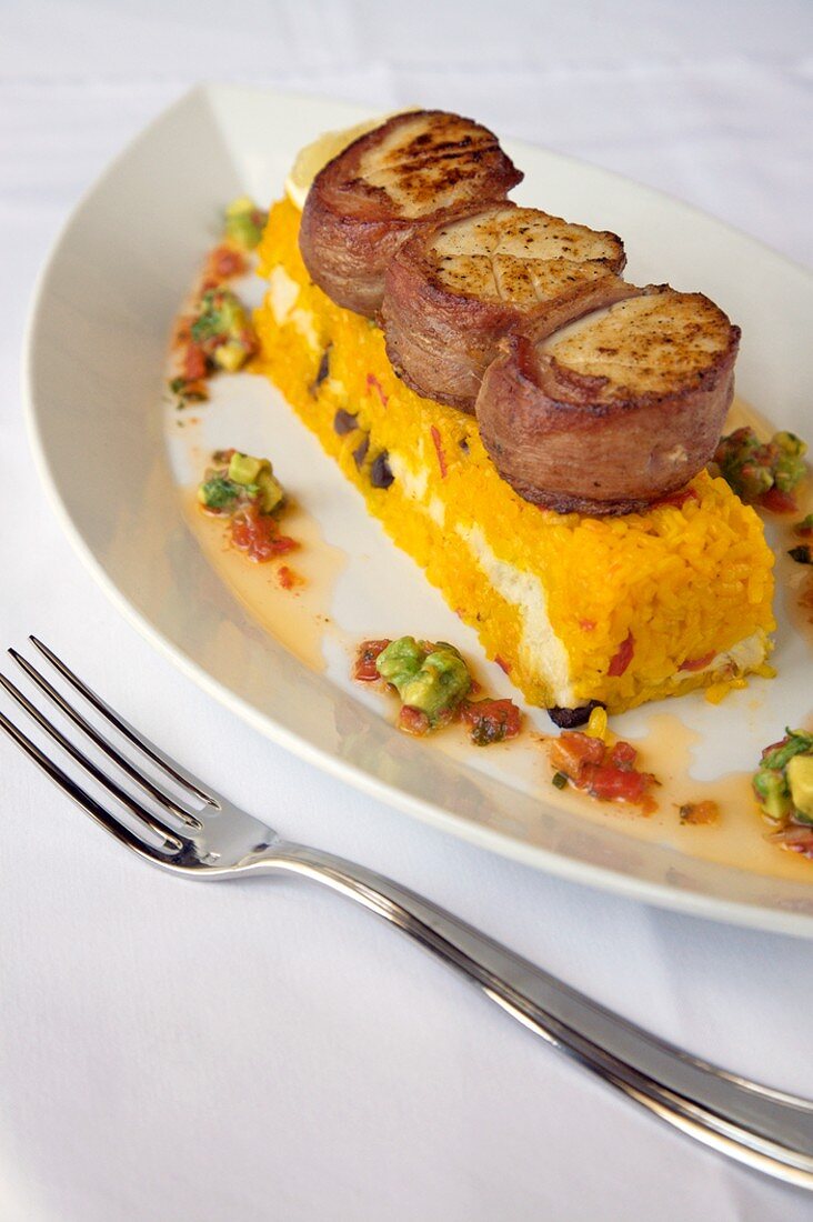 Bacon Wrapped Scallops Over Rice Timbale