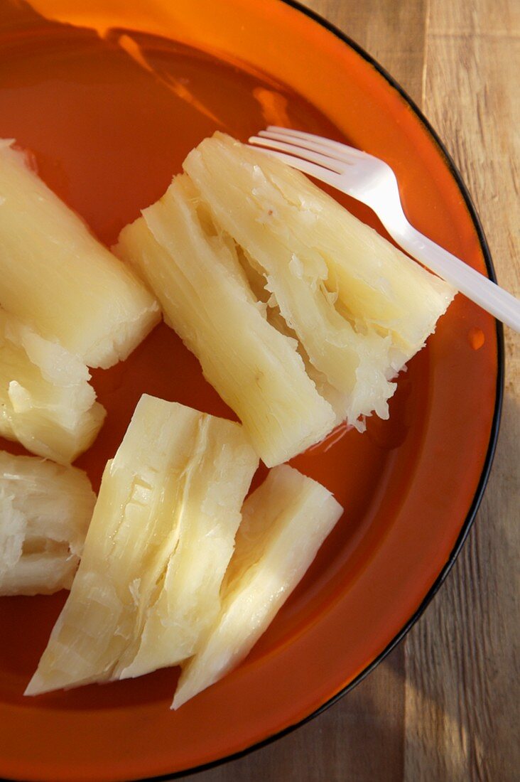 Boiled Yuca on a Plate with a Fork, From Above