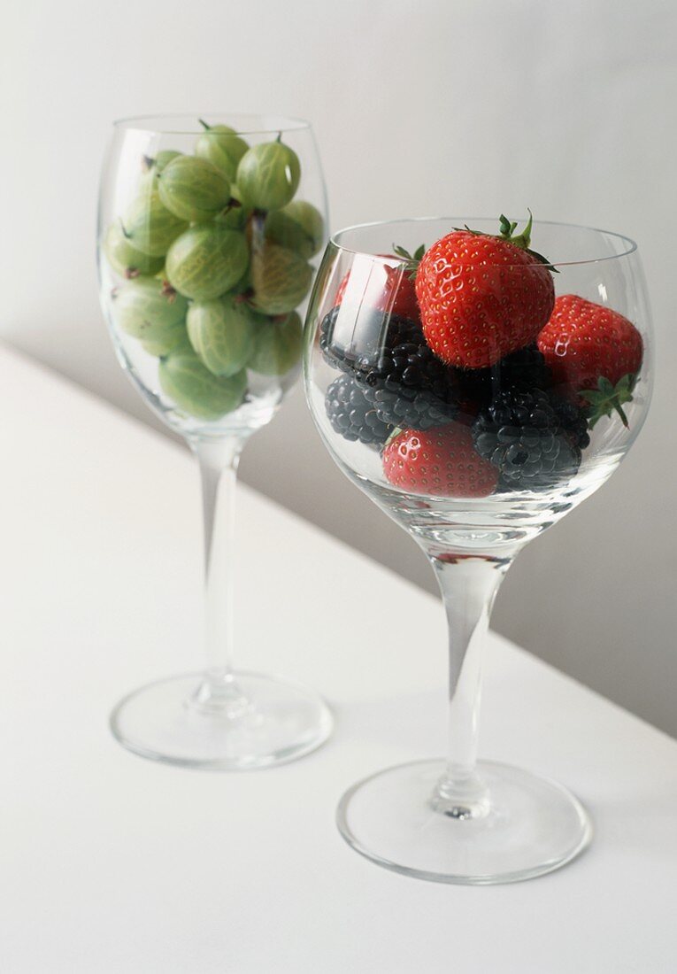 Two Wine Glasses Filled with Assorted Berries